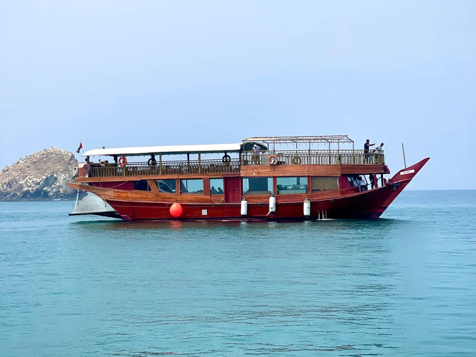 Air conditioned dhow at anchor near the rocks on the Dibba dhow cruise in Fujairah