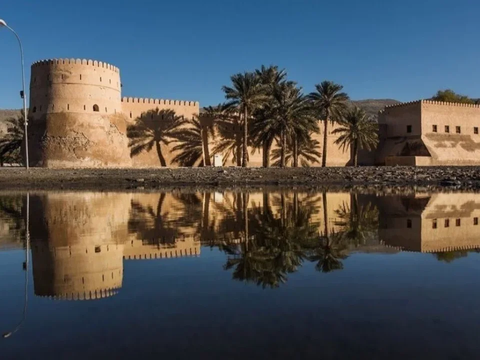 Khasab Fort reflected in the water on the Khasab city tour