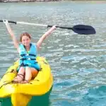 Child kayaking on the Khasab dhow cruise, Musandam