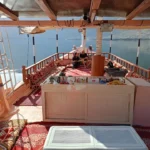 Shaded deck of the traditional overnight dhow in Khasab